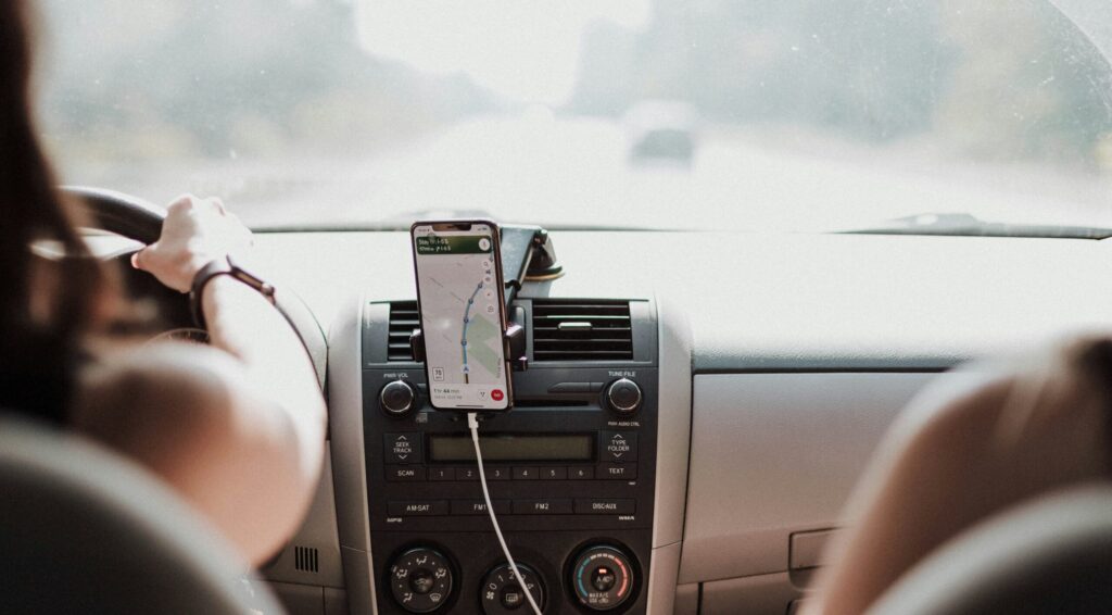 A driver behind the wheel looking at directions